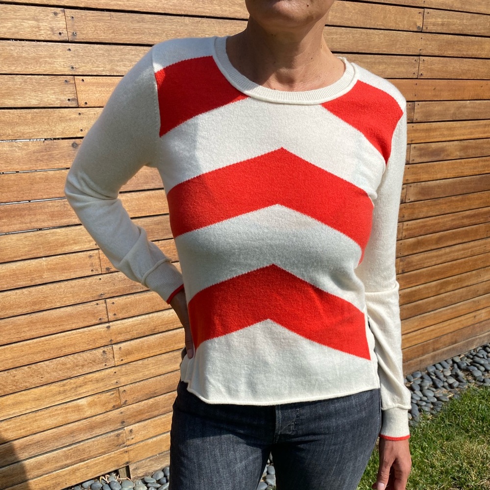 100 percent soft cashmere sweater.Bias stripe with red/orange chevron pattern .